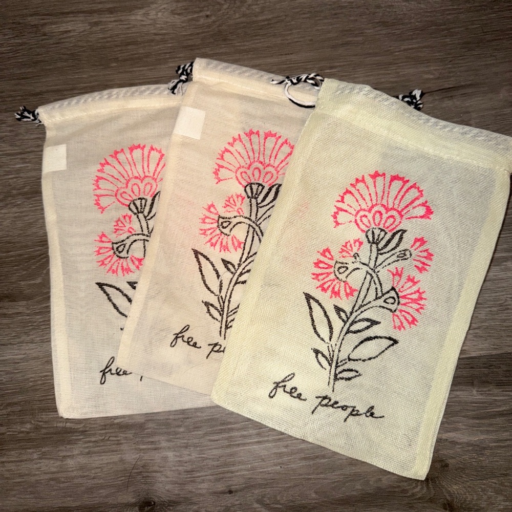 3 Free People Cream pouches
